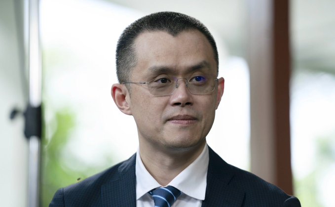 A serious-looking man with short dark hair and glasses, wearing a dark suit and striped tie, is shown in a close-up portrait against a blurred bright background. The image likely depicts Changpeng Zhao (CZ), CEO of Binance, whose quote emphasizes concerns over EU users losing access to top-tier crypto liquidity.