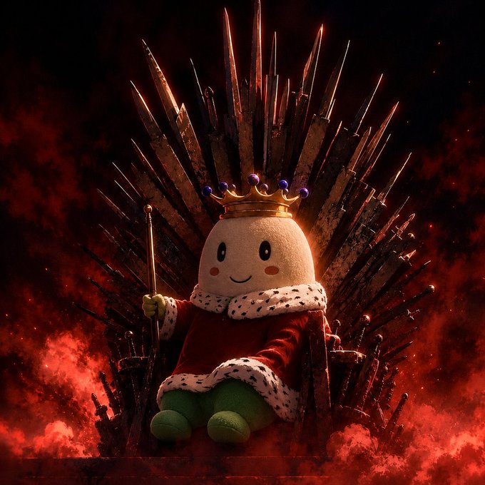 A whimsical plush character wearing a golden crown and royal robe sits upon an iron throne made of swords, surrounded by fiery red smoke.