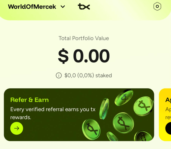 A screenshot of the 'WorldOfMercek' app showing a Total Portfolio Value of $0.00 and a 'Refer & Earn' section promoting tx token rewards.
