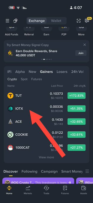 A crypto exchange app screenshot showing top gainers, with a red arrow pointing to the IOTX token showing a +51.35% increase at $0.00336.