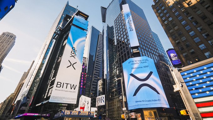 Giant Bitwise XRP ETF billboards tower over Times Square in New York City, featuring the bold "XRP" and "BITW" branding alongside a "Welcome XRP" message, visually marking the milestone of the fund surpassing $500 million in AUM just nine months after launch.