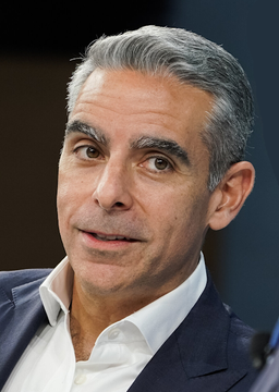 A close-up portrait shows David Marcus, the former Meta executive referenced in the post, speaking during an appearance, with his serious expression underscoring his warning about future generations valuing ownership of a whole Bitcoin.