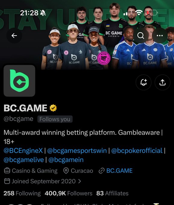 A screenshot of the BC.GAME Twitter/X profile (@bcgame), a verified multi-award winning betting platform in Casino & Gaming based in Curacao, showing 400.9K followers and featuring athletes in team jerseys.