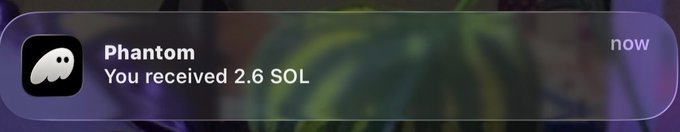 A notification from the Phantom wallet app displays "You received 2.6 SOL" against a blurred purple background. This serves as visual proof to commenters that the user follows through on their promise of sending SOL to reply participants in the giveaway.