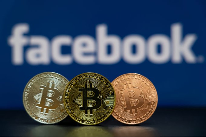 The image features three Bitcoins, each with a different color - gold, silver, and bronze. The Bitcoins are placed on top of a table against a blue background that displays the Facebook logo. The text "FACEBOOK" can be seen in the image as well. The arrangement of the Bitcoins suggests they might be used for investment purposes or simply as collectible items.