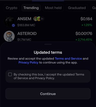 A "Trending" crypto list shows tokens ANSEM ($0.184, $183.8M MC) and ASTEROID ($0.00176, $1.7M MC), partially obscured by a pop-up requiring users to accept FOMO's updated Terms and Privacy Policy to continue using the app. The image supports the post's warning about the app's concerning new terms, which include account suspension without notice and unencrypted private key transmission.