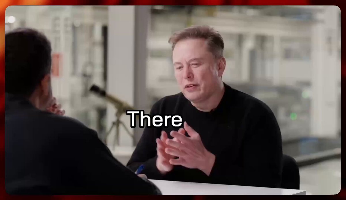 The image shows a man sitting at a table, wearing a black shirt, and talking to another person who appears to be a woman. The background of the image features a red frame that says "There". There are also some words written on this frame, which seem to be related to the post about energy or transactions.