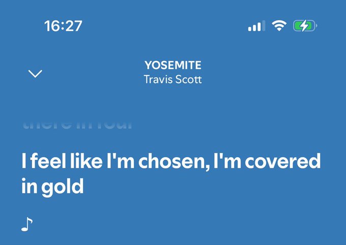 A screenshot from the Apple Music app displays the lyrics screen for Travis Scott's "YOSEMITE," showing the lyrics "I feel like I'm chosen, I'm covered in gold" at 16:27. The caption ties in with the "pov: you made $11 from web3" post by humorously pairing a small crypto profit with Travis Scott's boastful lyric about feeling rich and adorned in gold.