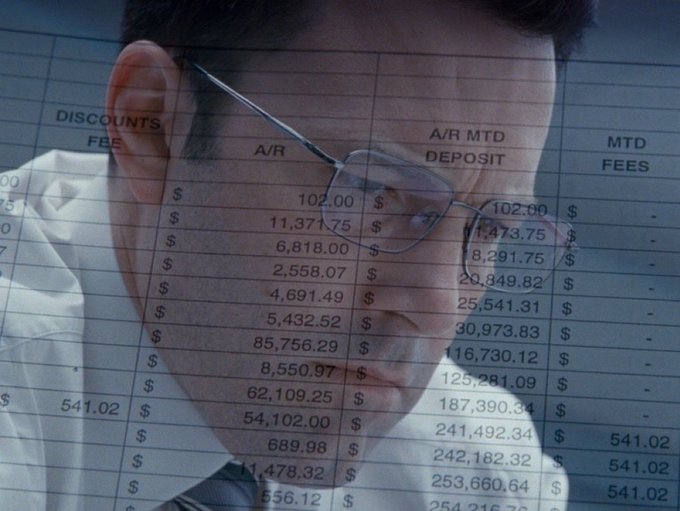 A man in glasses and a tie looks puzzled as a spreadsheet overlay with columns for "DISCOUNTS," "A/R," "A/R MTD DEPOSIT," and "MTD FEES"—showing figures like 102.00, 11,371.75, and 253,660.64—covers his face, humorously illustrating the accountant struggling to reconcile the absurd claim of pre-IPO Anthropic exposure from a "butthole" coin holding.