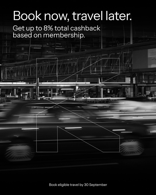 A black-and-white promotional graphic featuring a motion-blurred car driving through an urban setting, overlaid with bold white text reading "Book now, travel later" and "Get up to 8% total cashback based on membership," along with a large outlined "N" emblem and the deadline "Book eligible travel by 30 September."

The image visually reinforces the post's message about using the KAST card for hassle-free travel spending, with the cashback offer (up to 8%) and referral code POPEYE matching the promotional details advertised.