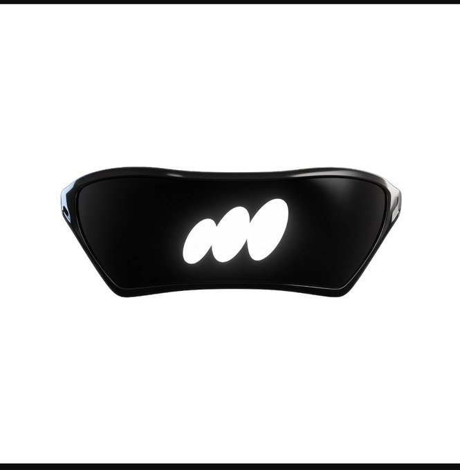 A sleek black visor or headset display with a glossy finish, featuring a white stylized 'M' or linked ovals logo in the center against a white background.