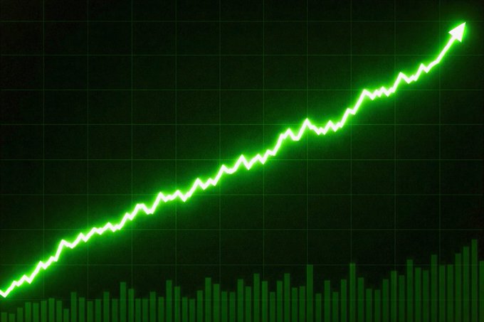 A glowing green line graph trending upward with an arrow at the end, overlaid on a dark background with green bar chart elements at the bottom, suggesting rising stock or cryptocurrency performance.