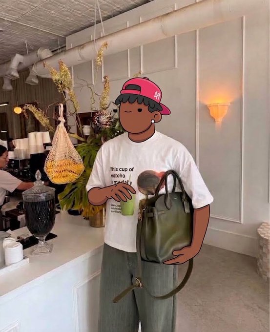 An illustration of a person wearing a pink 'LA' cap and a white t-shirt reading 'This cup of matcha...', holding a green drink and an olive green tote bag in a cafe setting.