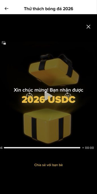 The image shows a yellow gift box with black stripes that has been opened up, revealing its contents inside. The text "Sự kiện Binance (pick & win 2026) USDC token SPCXB và vé xem trận đấu" is displayed in the image. This suggests that the gift box contains a virtual item, possibly related to cryptocurrency or digital assets, and it has been opened up for viewing by someone who wants to know more about it.

The post appears to be written in Vietnamese, which means that the image was taken and shared on a social media platform with users from Vietnam. The focus of the post is on the gift box, but the context provided hints at its potential connection to Binance or other cryptocurrency-related activities.