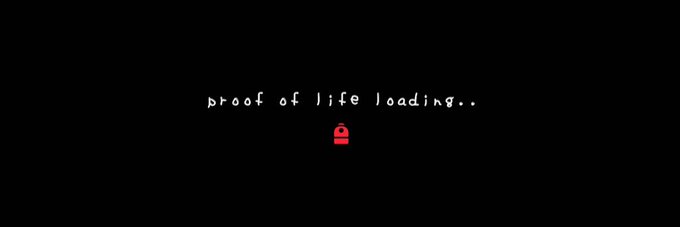 A black screen displays the text "proof of life loading.." in a handwritten-style white font, accompanied by a small red padlock icon centered below the text.