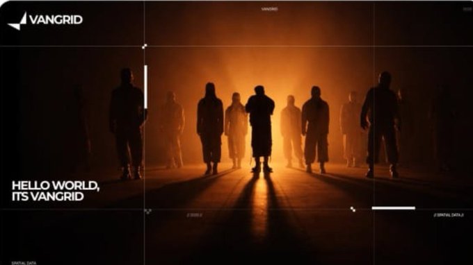 A cinematic dark poster for 'VANGRID' showing silhouettes of people standing in a line with the text 'HELLO WORLD, ITS VANGRID' in the bottom left corner.