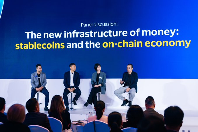 Four panelists sit on stage at Visa Connect 2026 in Bangkok, with a screen behind them reading "Panel discussion: The new infrastructure of money: stablecoins and the on-chain economy," as they discuss bringing stablecoins into everyday payments and the future of the on-chain economy.