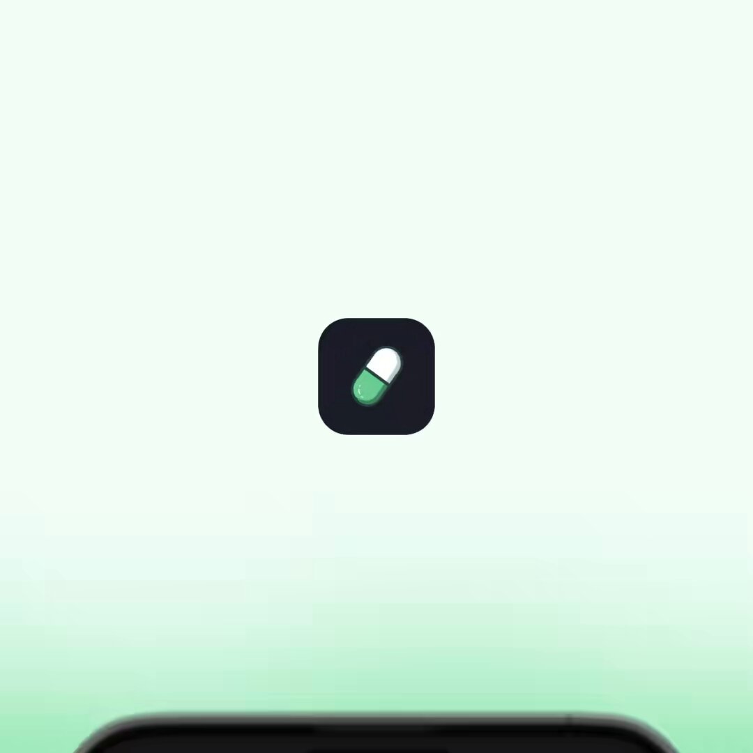 The image features a black smartphone screen displaying an app icon that looks like a pill. The app icon has a green background and a white border, giving it a simple yet recognizable design. Below the app icon, there's text that reads "focus on what is in the image and how it relates to the post". This suggests that the image might be related to a discussion or review of the app being displayed on the phone screen.