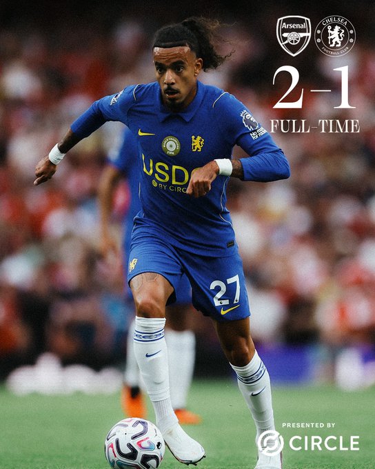 A Chelsea player wearing the number 27 blue kit dribbles a football during a match against Arsenal, with the final score displayed as "2-1" and logos for Arsenal, Chelsea, and Circle visible on the graphic. The caption "Even in defeat we stay winning" ties to the image's "FULL-TIME" result showing Chelsea's loss to Arsenal, highlighting the partnership branding with Circle and USDC.