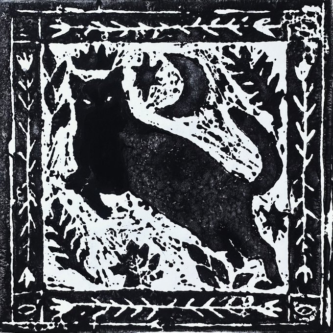 A black and white linocut-style print depicts a cat lounging on a leafy branch, framed by decorative borders featuring stylized foliage and geometric patterns. The post references a giveaway of 17 editions of this artwork honoring Sasha's beloved cat who lived to 19, with the feline subject embodying the cherished pet being celebrated.