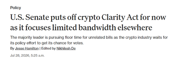 A news article headline dated July 28, 2026 reads: "U.S. Senate puts off crypto Clarity Act for now as it focuses limited bandwidth elsewhere," with a subheading explaining that the majority leader is prioritizing floor time for unrelated bills while the crypto industry awaits its policy vote. The piece, by Jesse Hamilton and edited by Nikhilesh De, aligns with the alert that the Senate has shelved the CLARITY Act to focus on a Russia sanctions bill ahead of the August 8 recess.