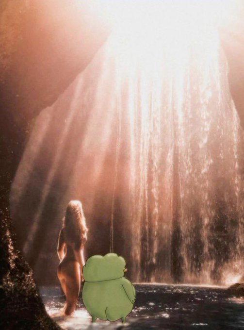 A woman stands in a pool facing a waterfall illuminated by sunlight, with a green cartoon frog character superimposed in the water beside her.