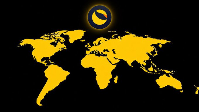 A simple yellow world map graphic on a black background with a circular orange and black logo positioned above it, likely representing a global cryptocurrency or blockchain project.