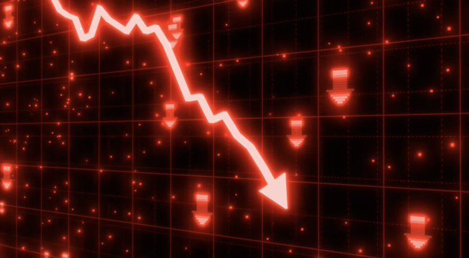 The image shows a stock market graph with a downward sloping line indicating a decrease in value or an economic decline. This visual representation suggests that companies like MicroStrategy might be experiencing financial difficulties, as they have paid off $1.38 billion of their outstanding debt while only having $870 million left on hand. The situation highlights the potential risks and challenges faced by companies in the business world due to market fluctuations.