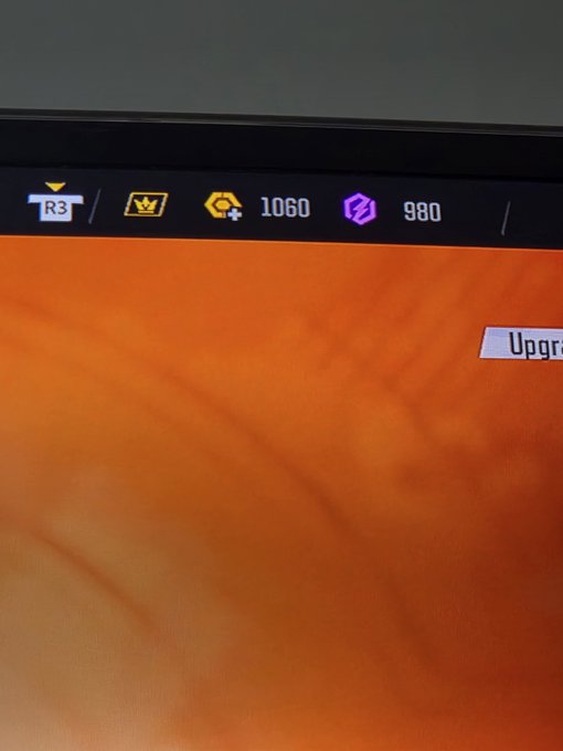 A photograph of a video game screen showing an in-game currency interface with values "1060" next to a gold 'G' icon and "980" next to a purple hexagonal icon.