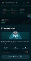 The image shows a dark-themed mobile app interface for "Kinetiq Markets" with a blurred appearance, displaying numbers like "126.79" and "3.93" along with what appears to be a marketplace header reading "MARKETPLACE." The blurriness visually suggests an outdated or soon-to-be-replaced version of the app, aligning with the post's announcement about a new update with features like copy-trading rewards and an enhanced leaderboard profile.