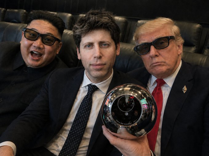The image shows three men sitting next to each other, with one man holding a silver ball up for the camera. They are all wearing suits and sunglasses. The caption of the image reads "$WLD $100", which could be interpreted as an advertisement or promotional material related to the event they are attending.