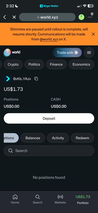 A mobile screenshot of the Binget Wallet app showing the world.xyz prediction market page for 'BxKb.YAzx' with a balance of US$1.73, a notice stating 'Stimmies are paused until rollout is complete', and tabs for Crypto, Politics, Finance, and Economics.