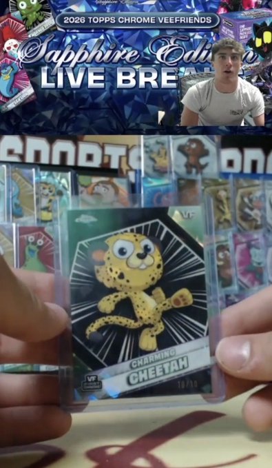 A livestream screenshot showing a '2026 TOPPS CHROME VEEFRIENDS Sapphire Edition LIVE BREAK' with a host visible and someone holding up a Charming Cheetah card.