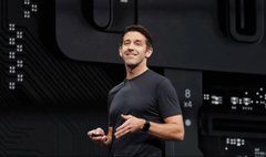 A young man in a dark shirt stands in profile against a backdrop of stock-ticker-style numbers, his head tilted upward with a confident, smug expression. The image humorously visualizes the caption about an X (Twitter) profile "outperforming memecoins," framing the man as a stock outperforming the volatile crypto market.