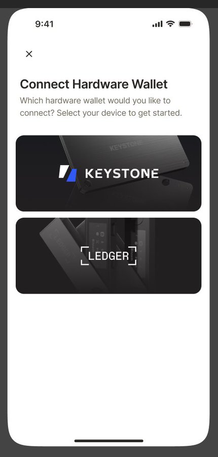 A mobile app screen prompting the user to 'Connect Hardware Wallet' with options to select either KEYSTONE or LEDGER.