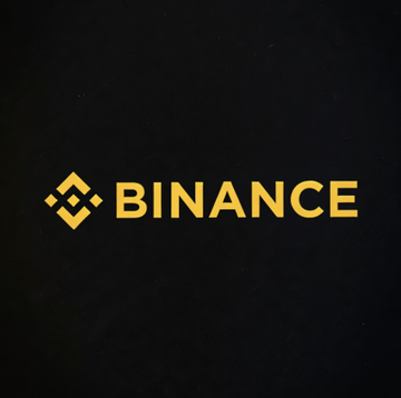 The Binance logo is displayed in gold on a black background. The image accompanies a news report about two Binance employees being briefly detained in the UAE as part of a police investigation into potential financial crimes on the cryptocurrency exchange.