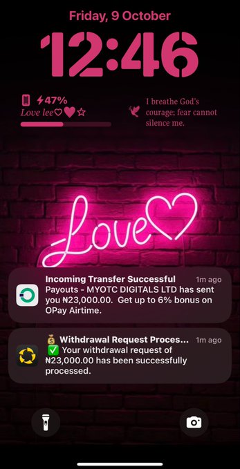 A smartphone lock screen displaying the time 12:46 on Friday, 9 October, with a pink neon 'love' sign wallpaper and notifications showing a successful incoming transfer of ₦23,000.00 and a processed withdrawal request from MYOTC DIGITALS LTD.