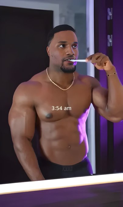 A muscular shirtless man brushes his teeth in front of a mirror at '3:54 am', illuminated by purple lighting. He wears a pearl necklace, a bracelet, and black 'POLO' underwear.
