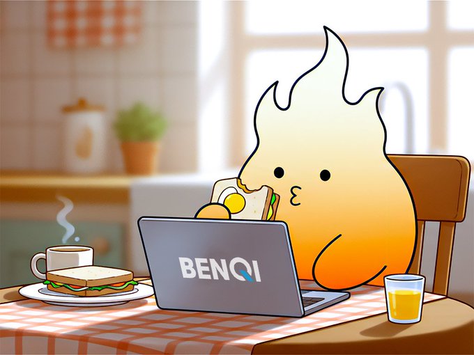 A flame-like cartoon character eats a sandwich while working on a laptop displaying the "BENQI" logo, with a coffee mug, sandwich, and glass of orange juice on the table.