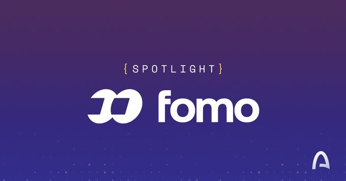 A purple gradient graphic featuring the word "{SPOTLIGHT}" above the white logo and name for "fomo," with a small "A" logo in the bottom-right corner.