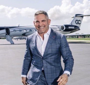 A smiling man in a blue blazer stands on a tarmac in front of a private jet labeled "GC" and tail number "N86GC," connecting to the post's excitement about Grant Cardone's Cardone Capital making a $22.3 million purchase of 350 Bitcoin. The image likely represents Cardone himself or his business, underscoring the "massive" scale of the cryptocurrency investment announced in the caption.