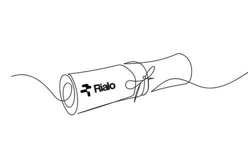 The image features a black and white line drawing of a rolled-up piece of paper, which has the word "RIALO" written on it. The paper appears to be wrapped around an object or surface, possibly a gift box or a package. The drawing is simple yet striking, with the use of black and white colors creating a stark contrast that makes the text stand out. This type of artwork can be used for various purposes such as advertising, packaging design, or even artistic expression.