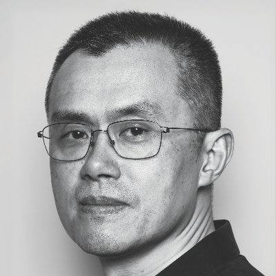 A black-and-white close-up portrait of an Asian man with short hair and rectangular glasses, photographed in profile against a plain light background.