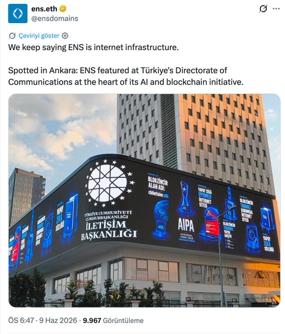 The image shows a large building with an advertisement for Ethereum displayed on its side, along with several other advertisements. The text of the post reads "Dünyanın önde gelen blok zinciri projelerinden Ethereum Name Service (ENS), İletişim Başkanlıgı'nın binasını ve “cbiletisim.eth" alan adını öne çıkardı.", and the date "05/06/2006".