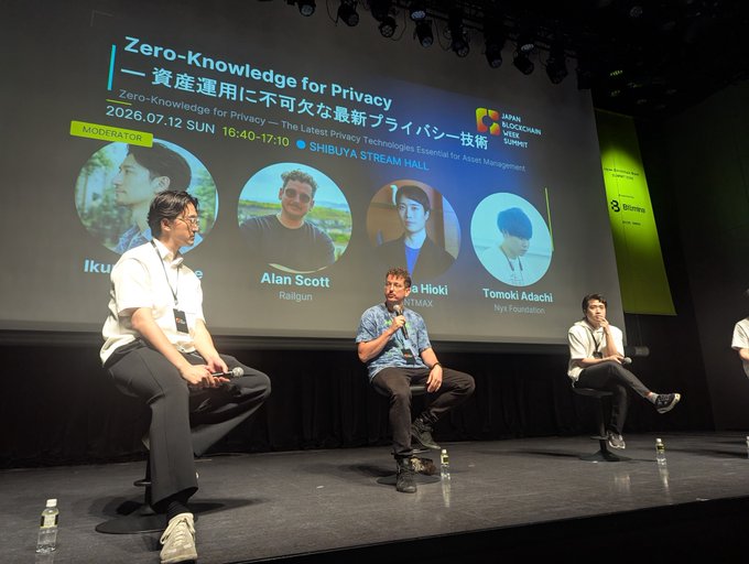 Three panelists sit on stage at Shibuya Stream Hall during a Japan Blockchain Week Summit session titled "Zero-Knowledge for Privacy," held July 12, 2026, with featured speakers including Alan Scott of Railgun. The image captures the live discussion on zero-knowledge privacy technologies essential for asset management.