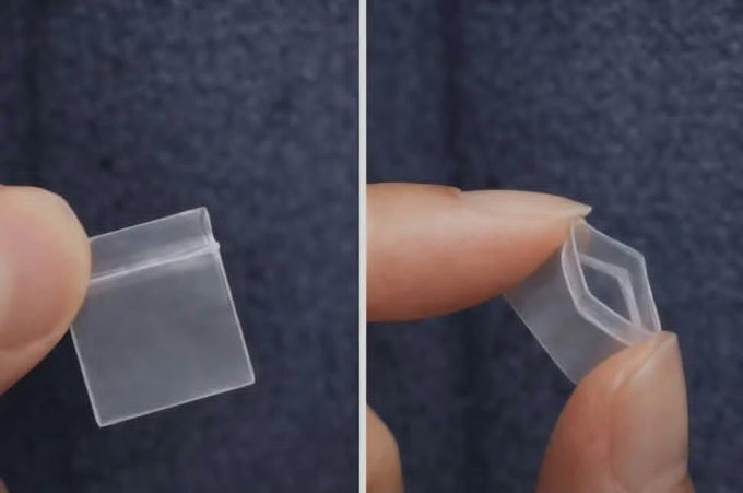 Two close-up views of fingers holding a small, clear plastic hinged container, showing it both closed and open.