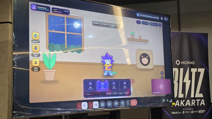 A large display screen showing a colorful virtual pet interface with a purple character, next to a banner reading 'MONAD BLITZ JAKARTA'.