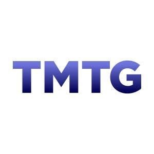 The image displays the "TMTG" logo in blue gradient lettering, representing Trump Media & Technology Group, the parent company behind Truth Social, which is referenced in the news about TMTG terminating its planned crypto partnership with Crypto.com.