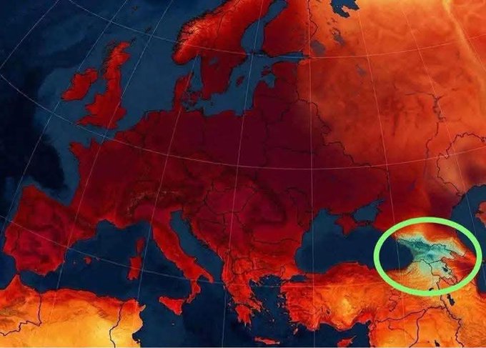 A heat map of Europe displays temperatures in deep red across most of the continent, with a green circle highlighting the Caucasus region near the Black Sea.