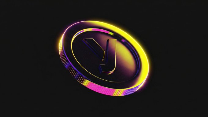 The image features a coin with a unique design that includes the letter "Y" in its center. The coin has a vibrant color scheme of purple, pink, and yellow hues, making it stand out against a black background. The text accompanying the image reads "@Yellow infrastructure!! What stands out here is the combination: @BuidlBNB is creating the routing layer for agent-to-agent commerce! @Yellow provides the trust and settlement layer underneath!", which highlights the coin's connection to the cryptocurrency world, specifically the blockchain technology behind it.